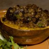 Picture of a half of an acorn squash stuffed with mushrooms and barley