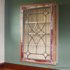 This is a picture of a wall cabinet made a vintage window